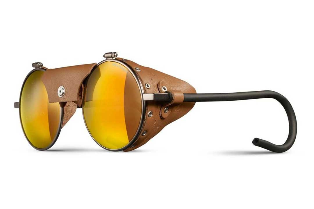 Side view of Julbo Vermont mountaineering sunglasses with brown leather side shields and gold mirror lenses