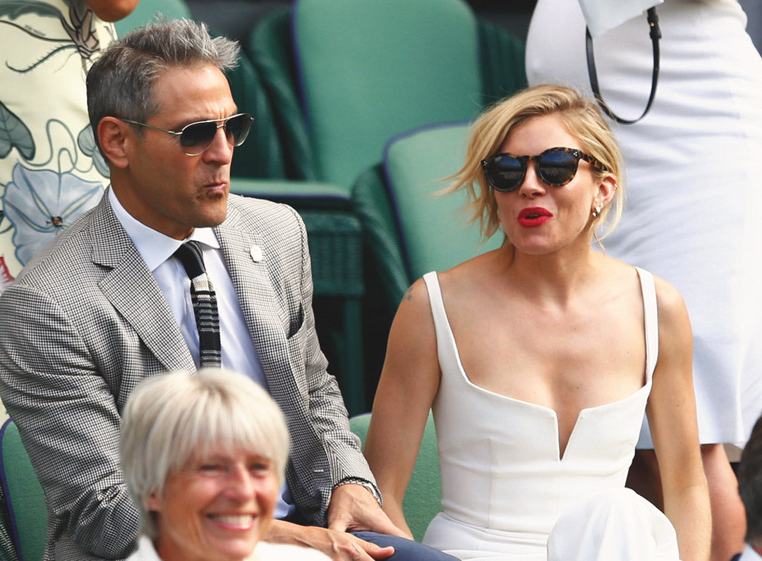 Sienna Miller wears round tortoise sunglasses amongst the crowd at Wimbledon tennis stadium