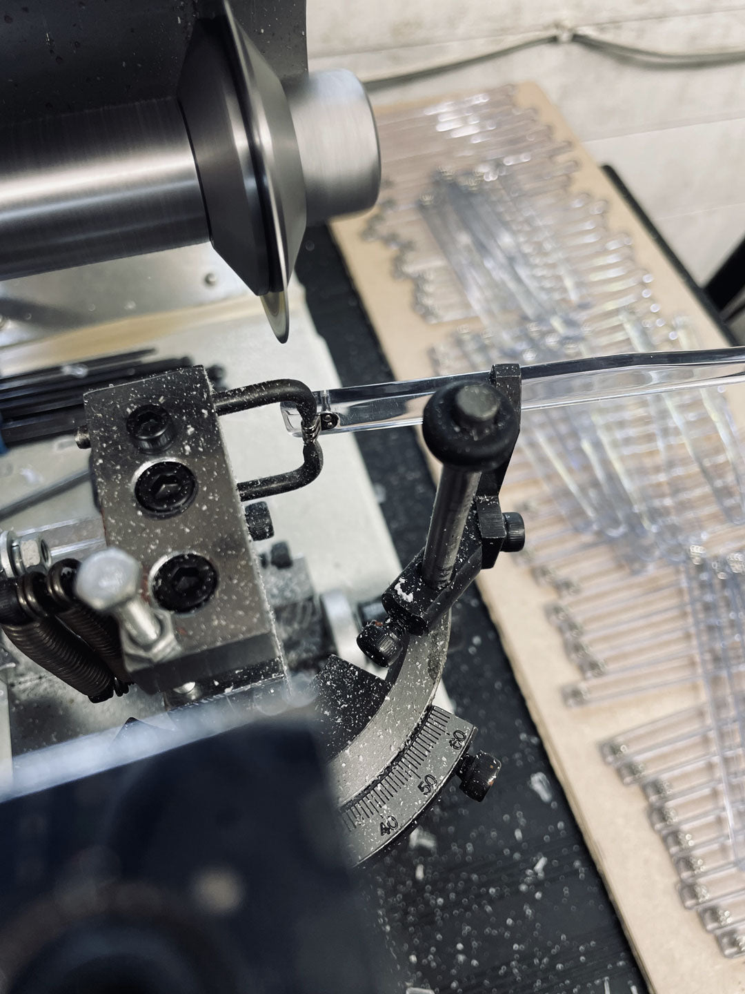 Sunglasses temple being cut using a precision disc cutting machine