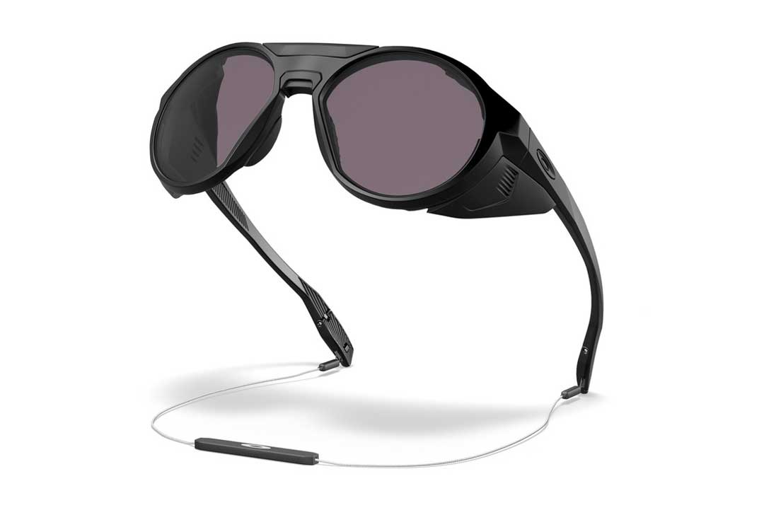Three quarter view of Oakley Clifden side shield skiing sunglasses with metal neck strap