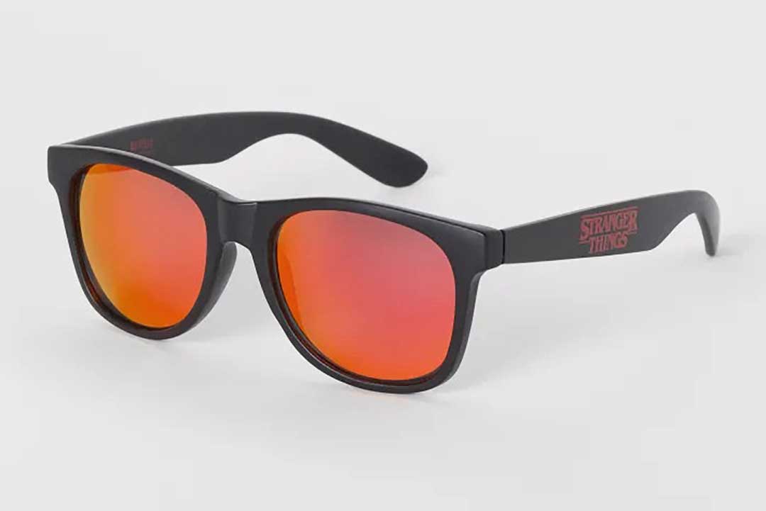 Three quarter view of official Stranger Things sunglasses frame with red tinted lenses