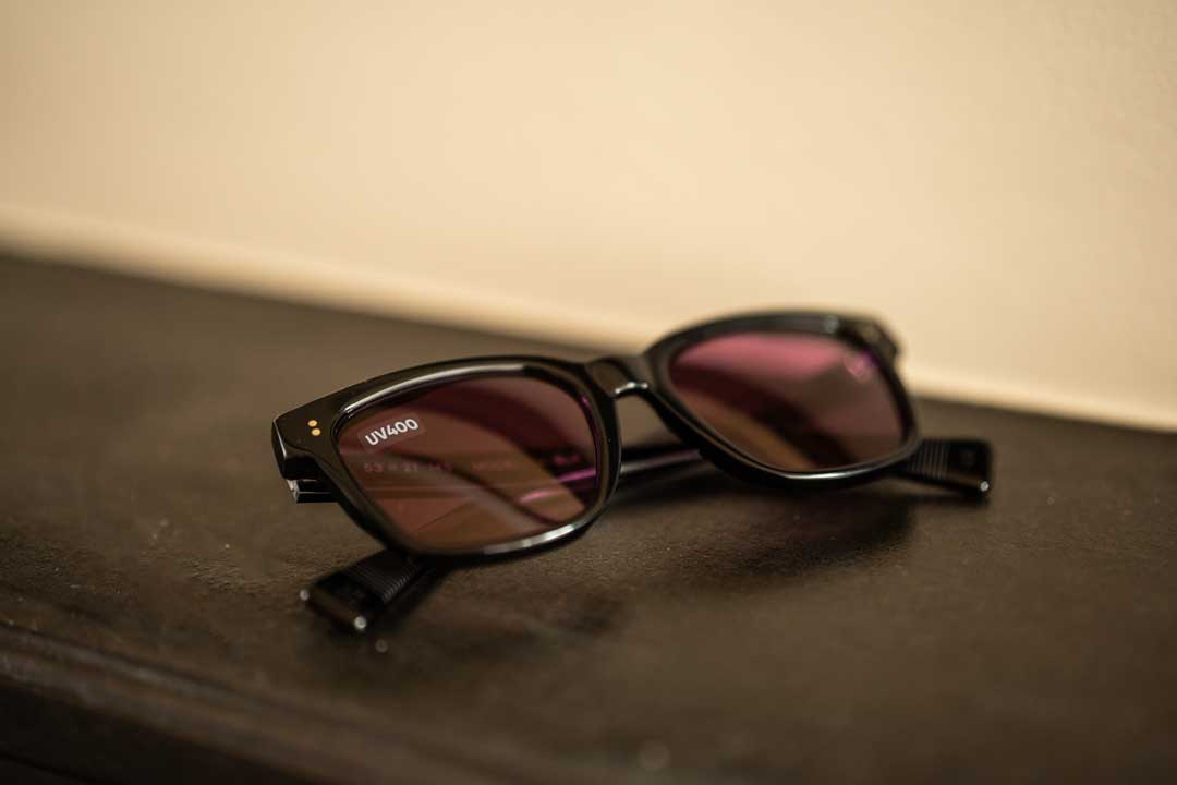 UV400 sticker on square black sunglasses frame