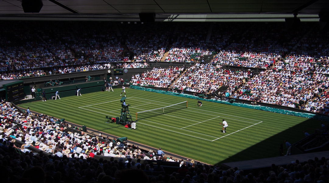 Wimbledon tennis court on bright sunny day singles match
