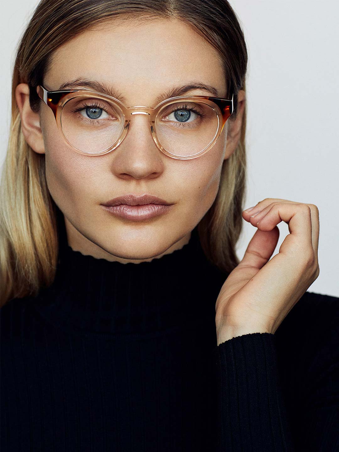 Woman wearing clear round eyeglasses