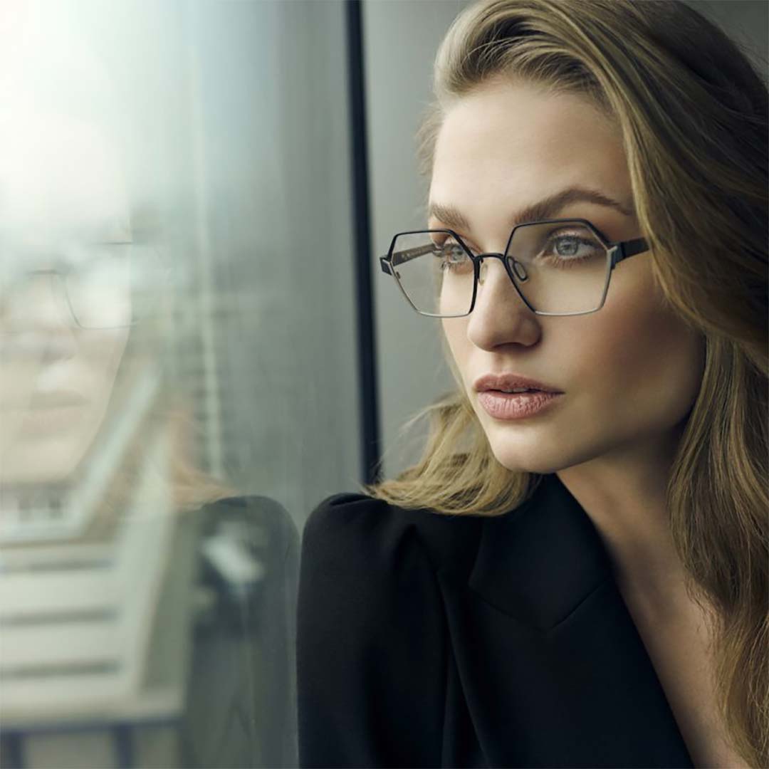 Woman wearing hexagonal style glasses