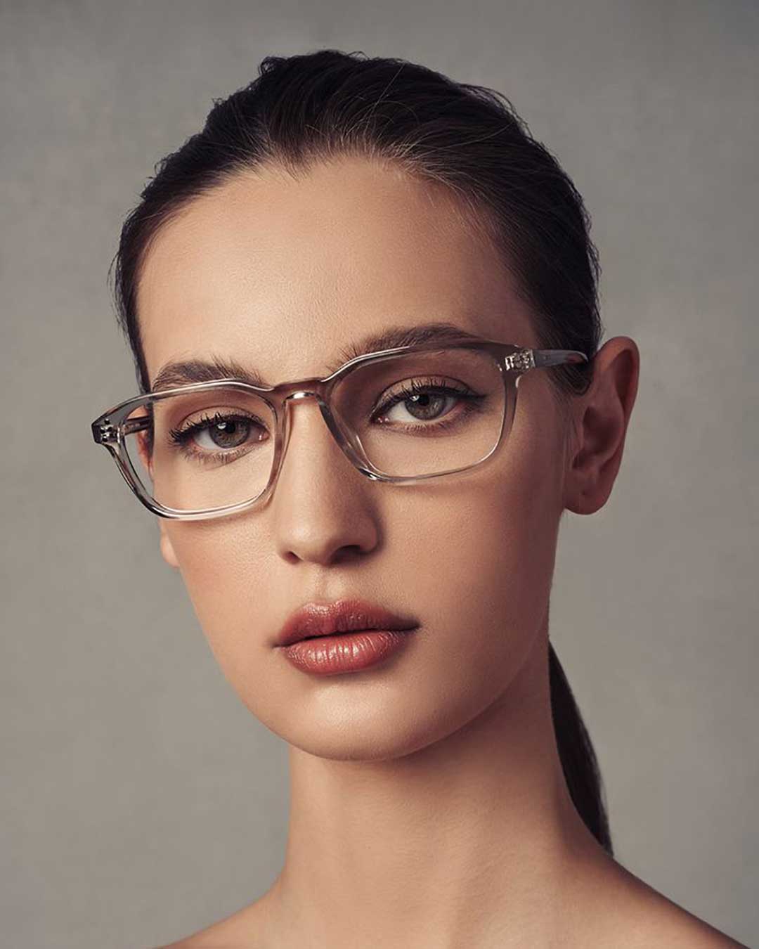 Young woman wearing crystal rectangular spectacle frame