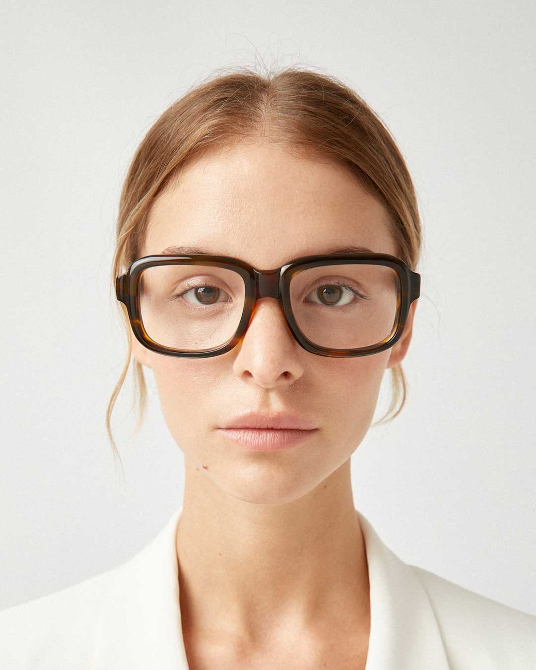 Young woman wearing very thick oversized spectacles