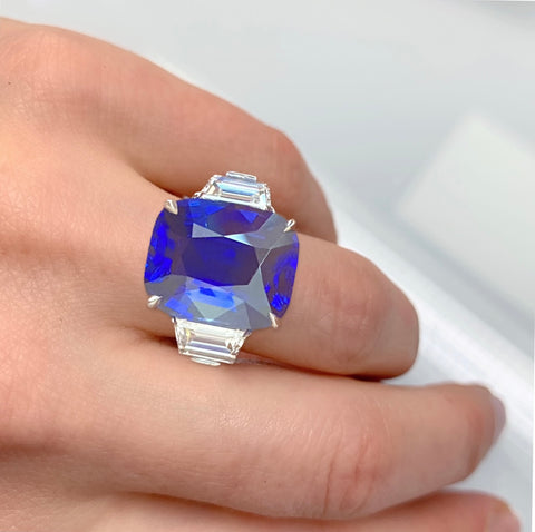 Cushion Blue Sapphire ring on a hand