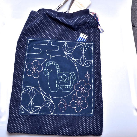 sample of sashiko preprinted design used as pocket on drawstring bag