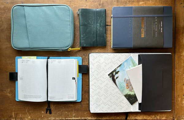 Notebook covers and notebooks on a table