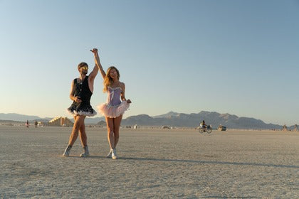 A man and woman wearing tutus at the Burning Man festival