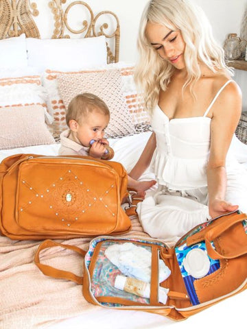 mother and baby using boho baby bag