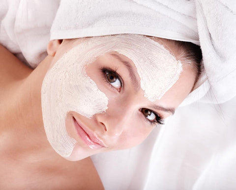 woman wearing face mask to treat dry facial skin