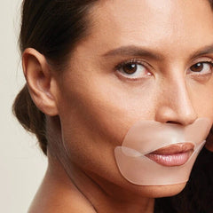 Putting on SiO Beauty's LipLift to help reduce wrinkles around your mouth