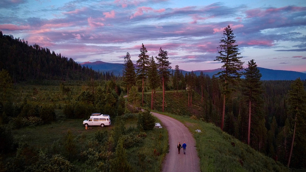 Van in the woods with Emily and Jake