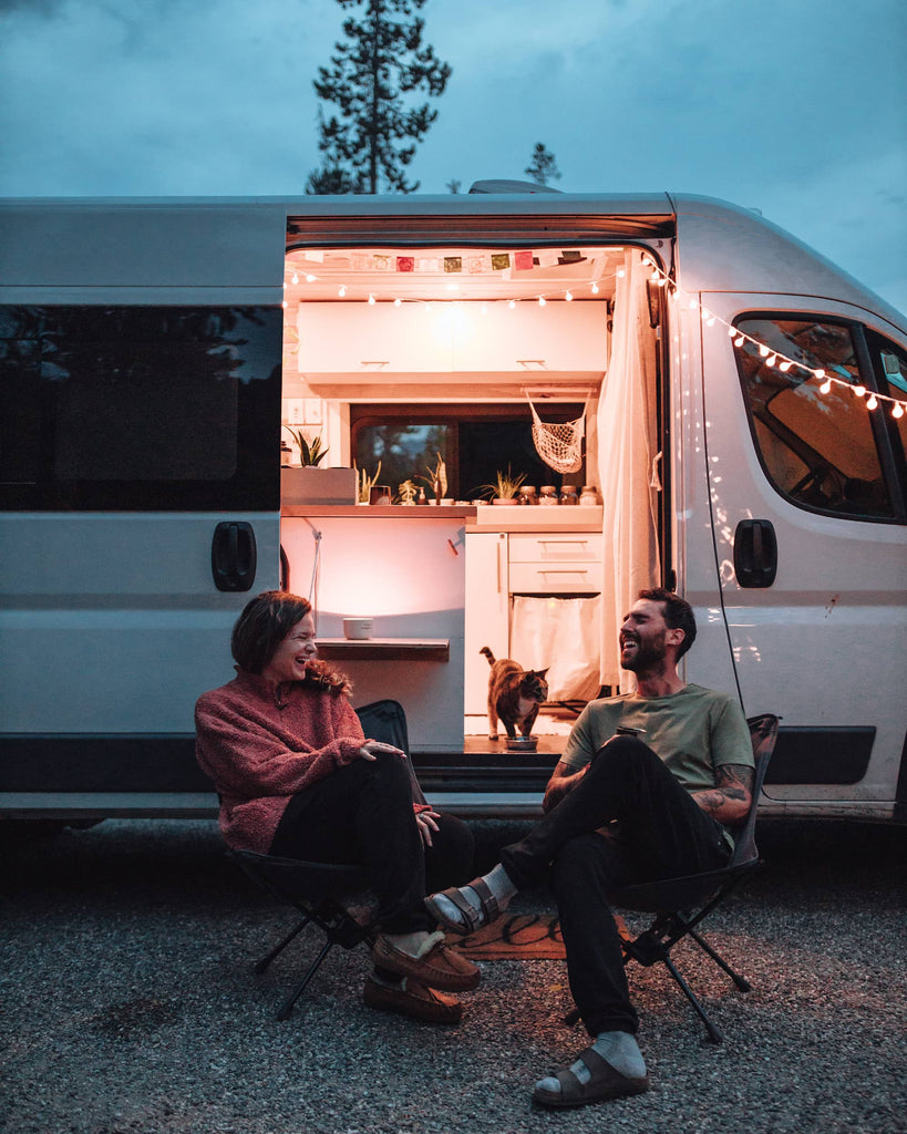 James and Anna from leave the map hanging out outside of the Van