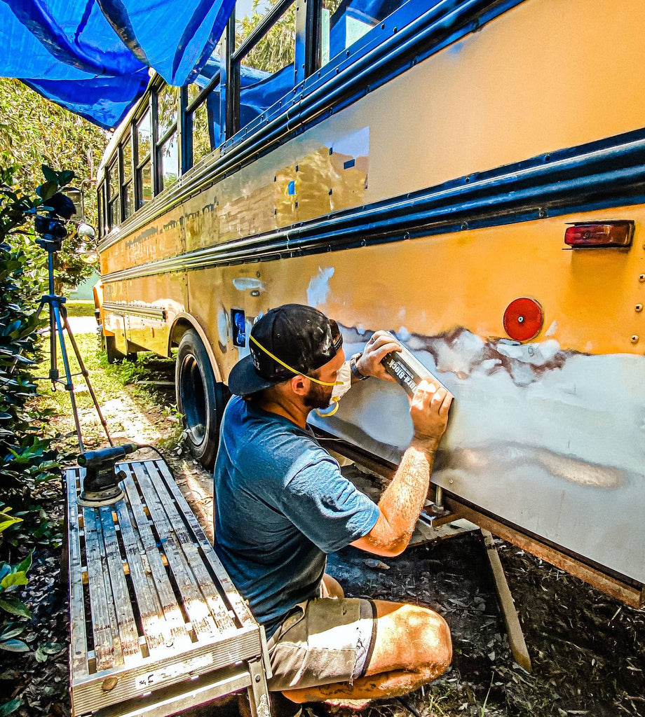 Wes working on the bus conversion, nautical nomads