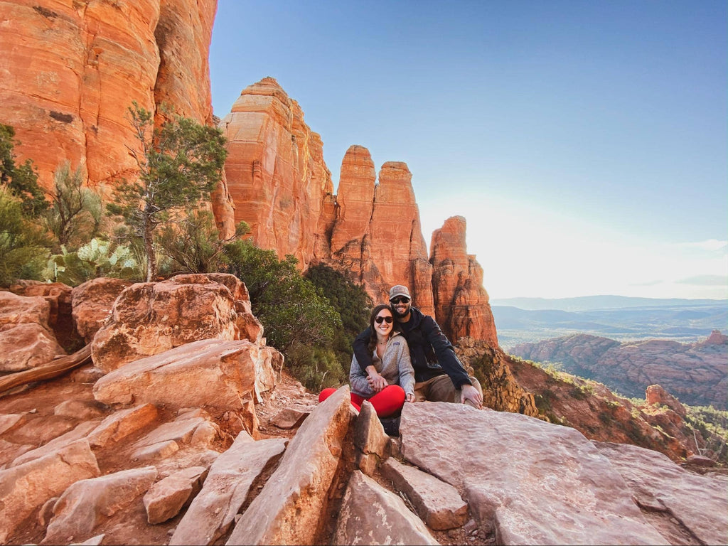 Meg and Ty from we.the.wanderers hiking in the canyon