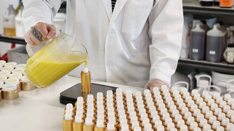 Honey Girl filling HoneyGlo Bottles