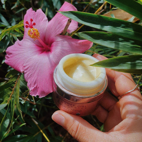 Woman Dipping into Our Luxurious Rose Creme