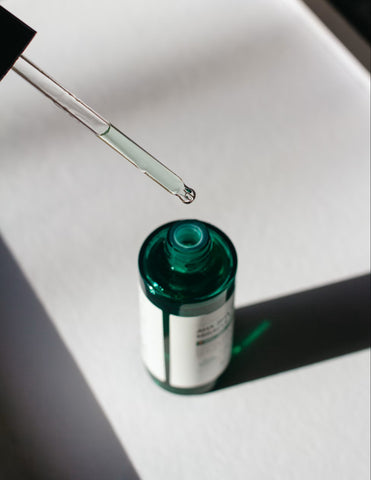 Essential Oil dripping from pipette