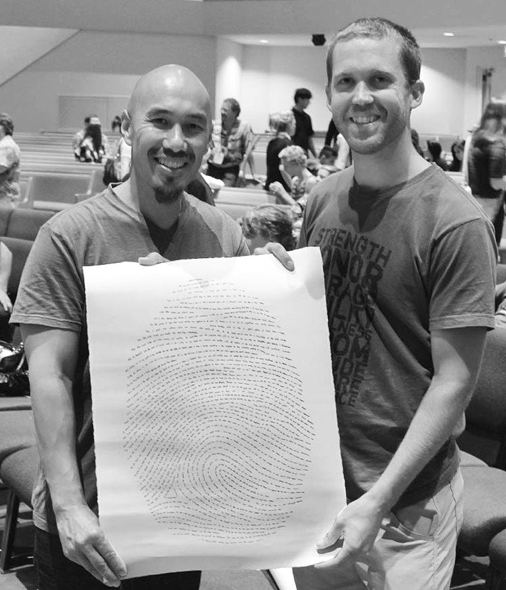 Jason and Francis Chan holding Screenprint artwork