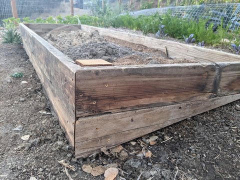 raised bed framework secured with wood offcuts 