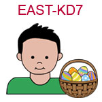 EAST-KD7 Light skinned black haired boy wearing a green shirt next to basket of Easter eggs