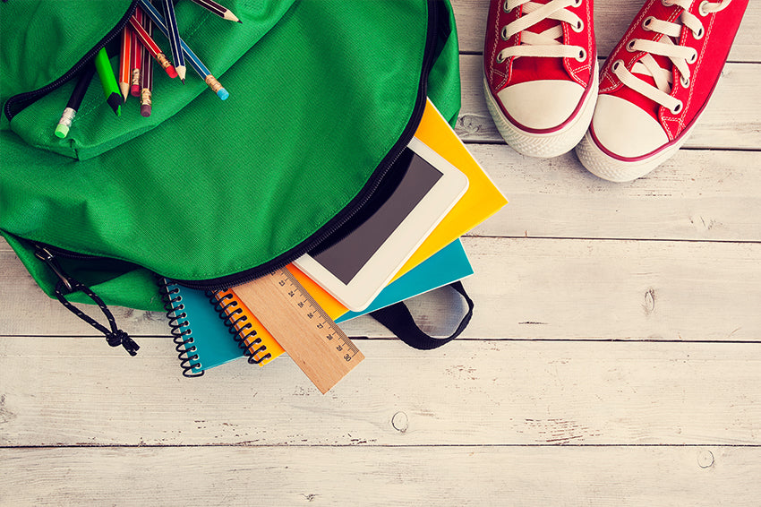 Packing her backpack for school Stock Photos and Images