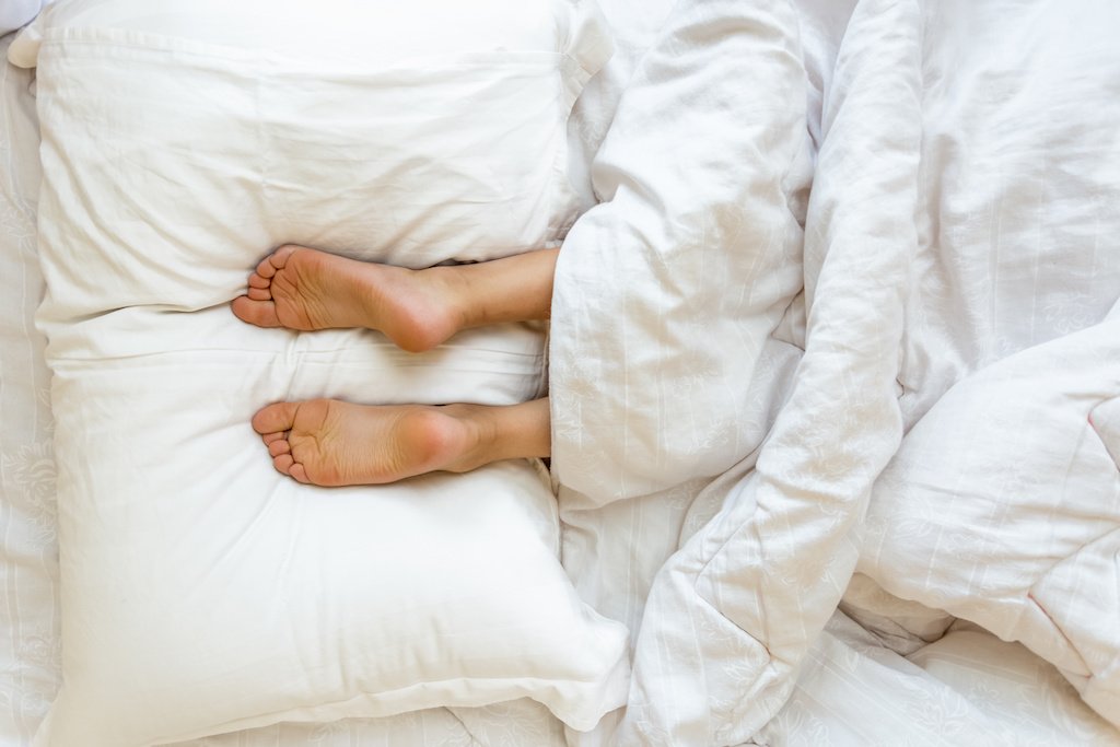 What Should You Do With Your Bed's Throw Pillows When You Sleep?