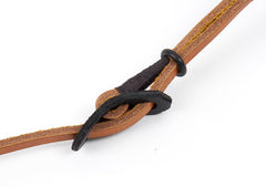 Leather buckle on adjustable camera neck strap.