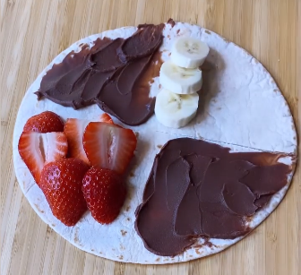 Tortilla Hack with chocolate brigadeiro, strawberry, and banana