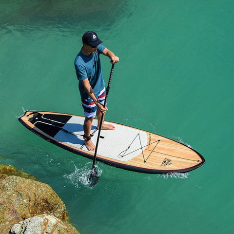 a man on a stand up paddle board
