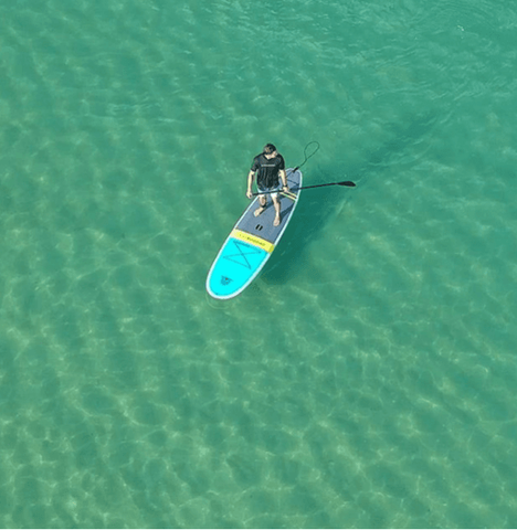 open water paddle boarder