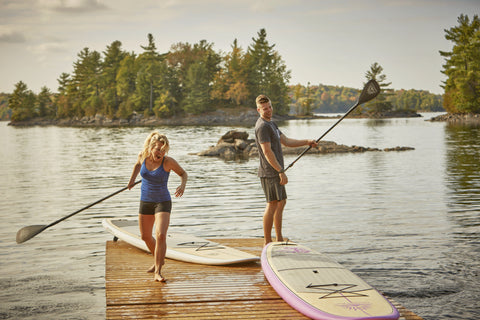 Paddle Boarders holding paddles