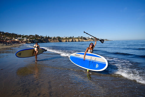 Paddle Boarders holding paddles