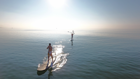 Paddle Boarders at Sunset