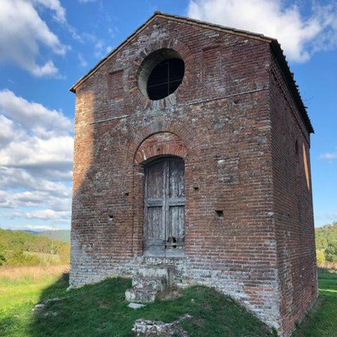Tuscan Style Home Décor: A Guide The 5 Main Things to Know - One of my favorite buildings is this small Tuscan structure next to the massive abandoned Abbey of San Galgano, which is located in Chiusdino, Italy in Tuscany.