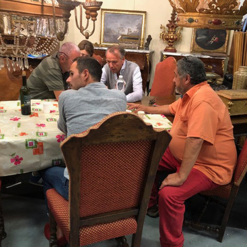 Tuscan Style Home Décor: A Guide The 5 Main Things to Know - Tuscan antique dealers relaxing over the lunch hour at the Parma Antique Fair