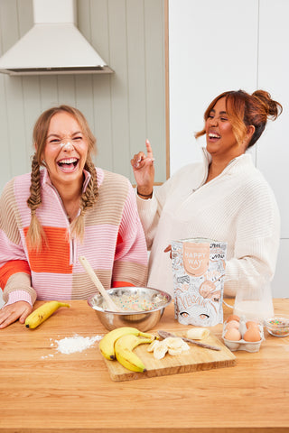 Girls baking with Happy Way's vegan protein powder