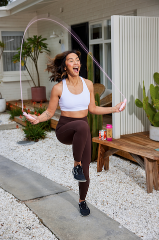 Girl exercising with skipping rope