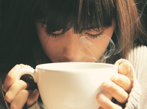 Girl drinking from mug