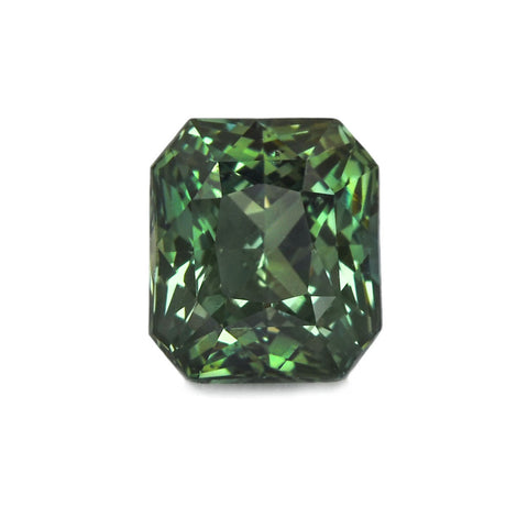 A rectangular cushion cut green sapphire gemstone.