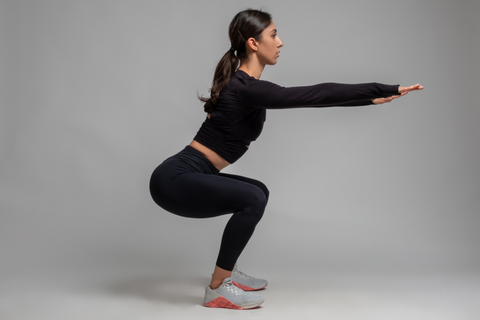 woman doing the squat exercise