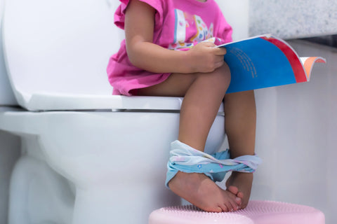 potty training girl on toilet