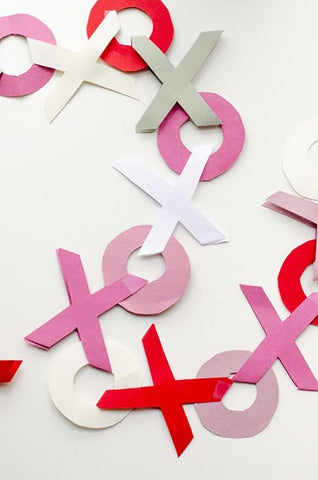 Noughts and crosses coloured paper garland craft as featured on Little Hotdog Watson blog