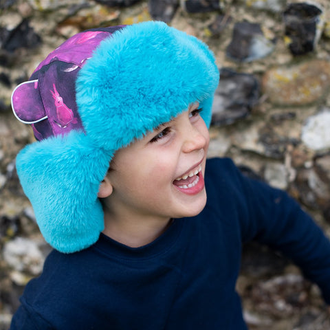Child wearing Little Hotdog Watson Winter hat in Space Bunny Print