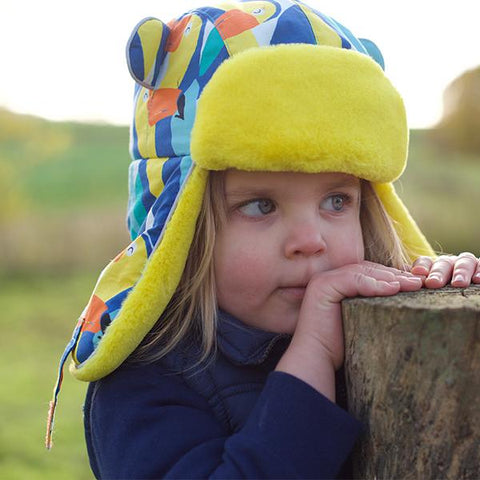 Child wearing Little Hotdog Watson Winter hat in Toucan Play Print