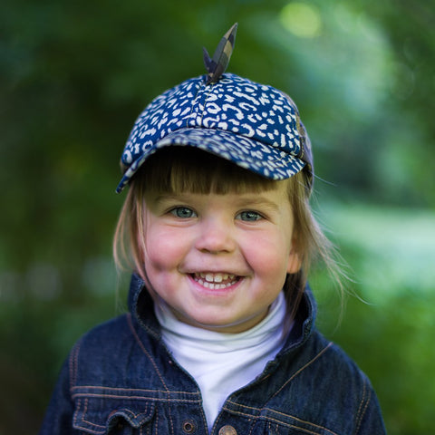 Child wearing Little Hotdog Watson Summer hat in Leopard and Camo Print