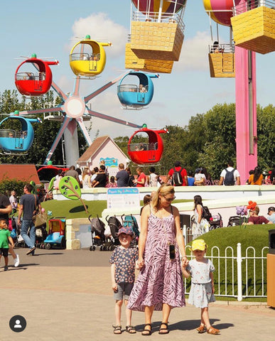 Emma Paton aka Finlay Fox with her children at a theme park